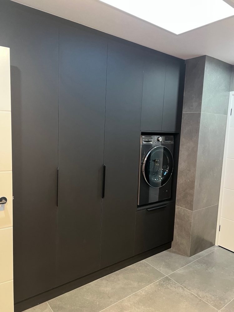 Bonython laundry with floor-to-ceiling joinery and a concealed washing machine